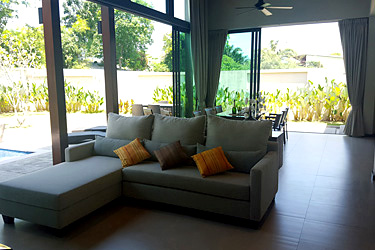 Living, Dining Area with Pool and Garden View